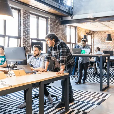 men at standing desks